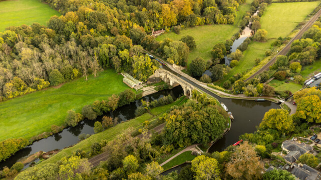Aerial view of the historic Dundas Aqueduct over a river in England.