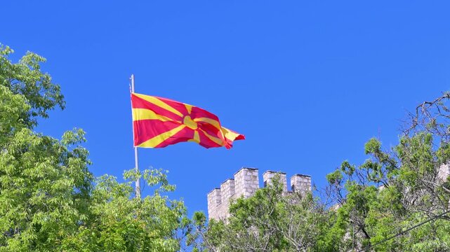 Macedonian flag waving in the wind over Samuel's Fortress and Ohrid, Macedonia