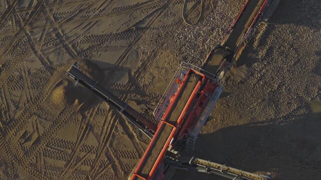 Drone aerial of large mineral sand and gravel quarry mine in southern midwest Ohio for resource mining for manufacturing building materials across United States construction at open-pit excavation sit