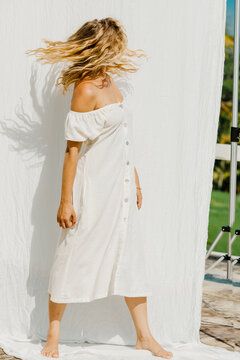 Caucasian girl in motion wearing organic linen dress