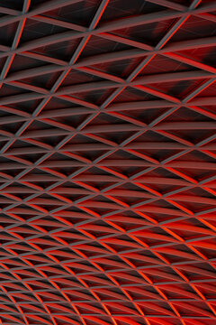 Geometric station ceiling illuminated with red light