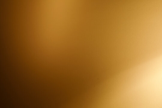 Warm golden brown abstract background with soft light