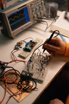 Electronics Prototype Testing on Breadboard With Oscilloscope Probe