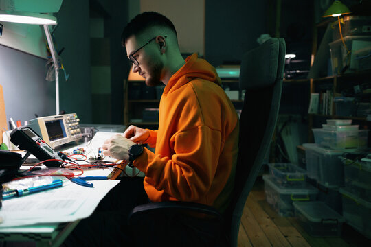 Young Electronics Engineer Working On Circuit Prototype