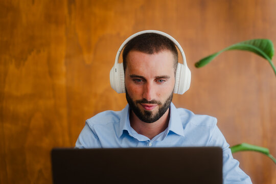 Focused businessman wearing headphones