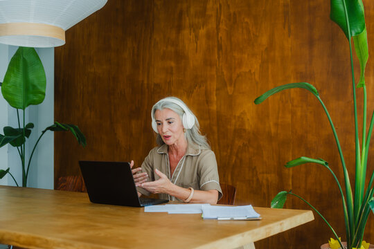 Female professional on virtual meeting in modern office