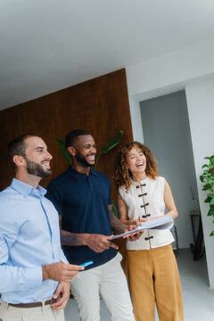 Business team laughing during brainstorming meeting session