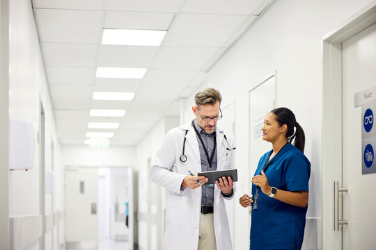 Doctors Discussing in Hospital