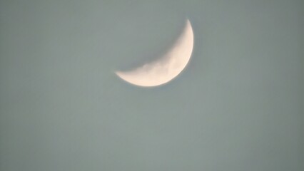 Crescent Moon Visible in the Daylight Sky Background © Willy