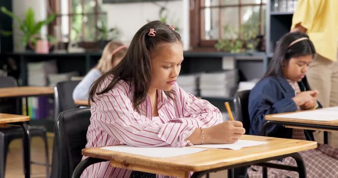 Girl, student and writing in classroom for test, learning and smile for easy question on paper. Teenager, education and quiz in high school for development, academic assessment and happy for solution