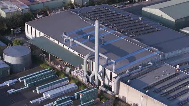 Melbourne, VIC, Australia - 04 October 2026: Aerial view of Kilsyth South factories featuring large industrial rooftops, ventilation systems, and solar panels.