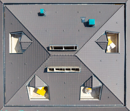 Overhead Top Down View Of Tiled Roof With Dormer Windows