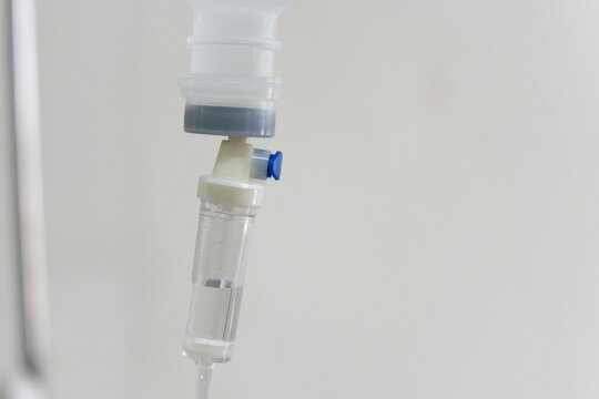 Close up set iv fluid intravenous drop saline drip for accident and seriously patient in hospital room.Medical treatment emergency patient.Medical treatment and cure concept.