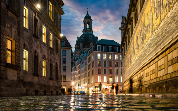 Dresden, Germany. Evening view from the street Augustusstrabe to the Dresden Frauenkirche and old porcelain artwork Procession of princes (Fuerstenzug), Dresden, Germany.