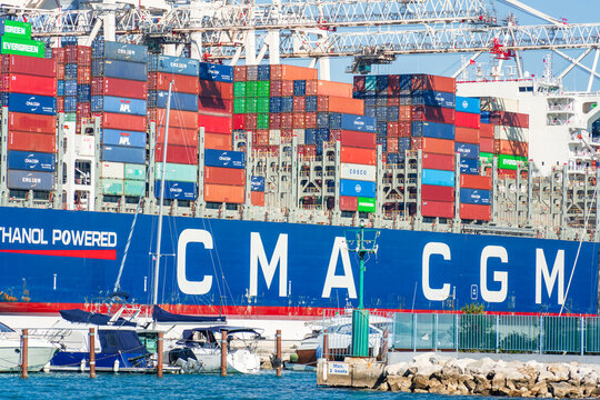 Koper, Slovenia - October 4, 2026: A large CMA CGM container ship loaded with colorful shipping containers is docked at the Port of Koper