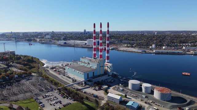 Aerial view of nova scotia power station and striped stacks beside halifax harbour