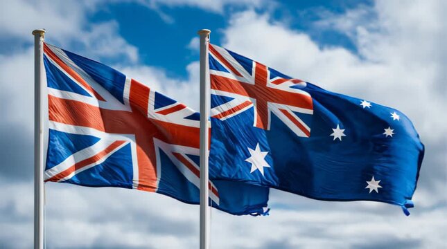 Flags of Australia and United Kingdom waving in the wind on a cloudy day
