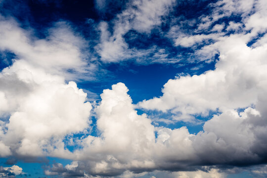 blue sky with white fluffy clouds