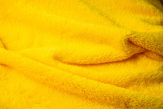 Cozy yellow faux fur texture background