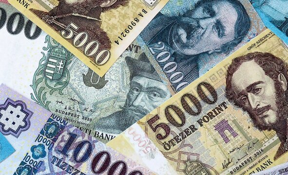 Big amount of Hungarian forint money banknotes. Hungary cash bills of HUF currency close up