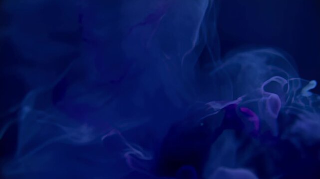 Ink Cloud Expanding and Dissolving in Blue Liquid