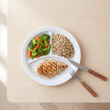 Balanced Meal Plate with Grilled Protein, Vegetables and Whole Grains Overhead View