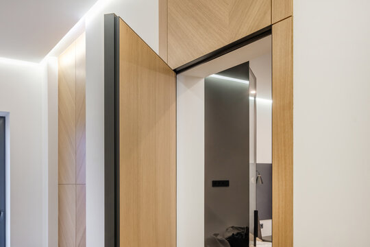 door handle on white wooden door in interior. Knob close-up elements. Door handle, fittings for interior design