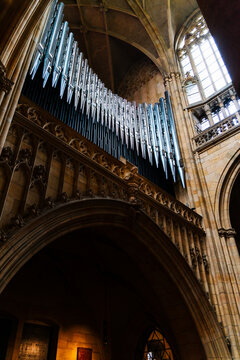 Prague, Prague, Czechia - 05 October 2026: View of the pipe organ inside the Gothic St. Vitus Cathedral, featuring intricate stone arches and stained glass windows.
