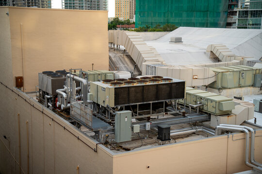 Industrial HVAC Cooling System with Large Ventilation Units and Pipes on a Commercial Building Rooftop