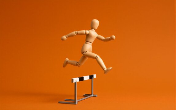 Wooden figure leaps over hurdle against vibrant orange background.