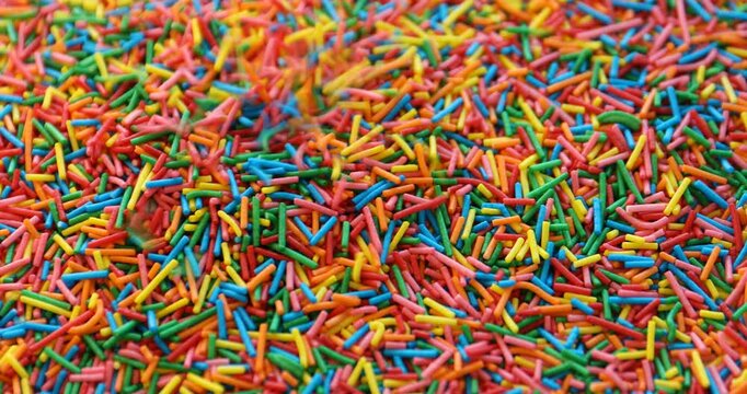 Many bright rainbow sprinkles. Decoration for dessert