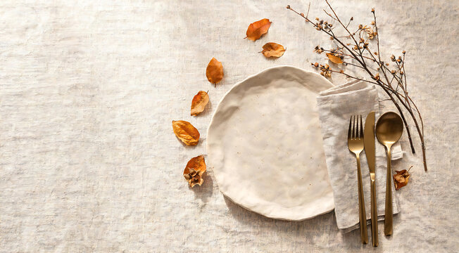 Minimalist autumn table setting with plate