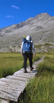 Boy walks on the Dolomites of Mandrone