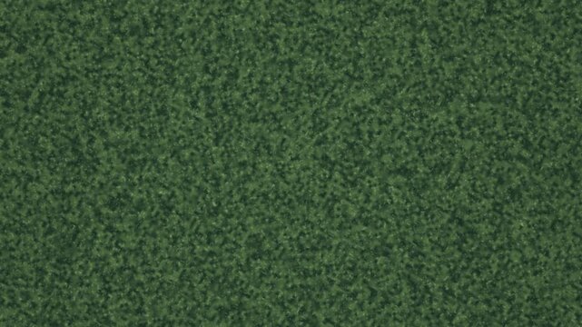 Seamlessly looping video clip of lush green grass texture from a bird's eye view, perfect for backgrounds and nature scenes