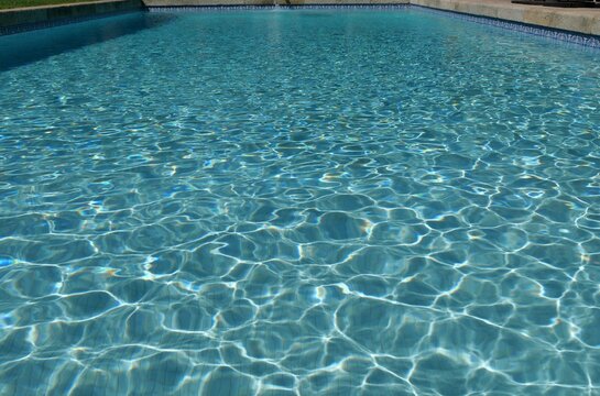 Swimming pool water surface with light ripple pattern