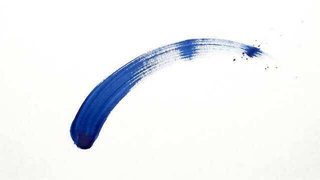 A single bold blue watercolor brush stroke curved on a white background, showing texture and, pigment variation in, the paint