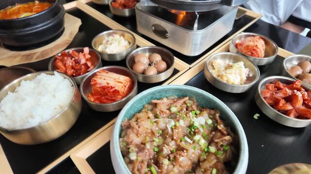 Spread of Traditional Korean Food with Bulgogi Stew and Banchan