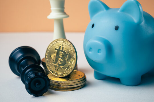 Blue piggy bank with a stack of golden cryptocurrency coins, digital saving, representing digital currency, blockchain, investment, saving, and the future of finance concept