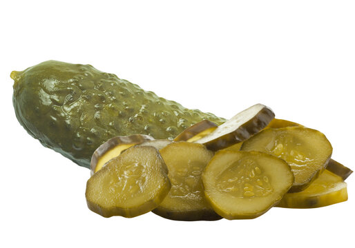 Slices of marinated pickled cucumber next to a whole pickle