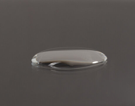 Pure water droplets on a dark surface tension. Water drops rolling off waterproof coating surface tension physics detail clean background, Macro Photography