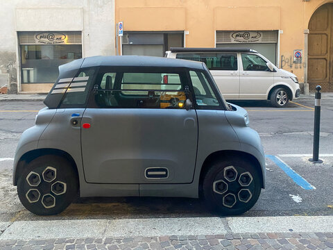 Citroen Ami electric microcar parked on urban street, representing sustainable city mobility and compact transport