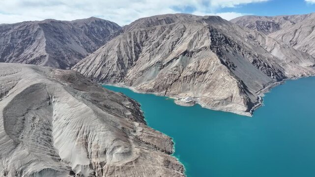 Aerial view of Bandidier Blue Lake surrounded by barren mountains in Xinjiang
