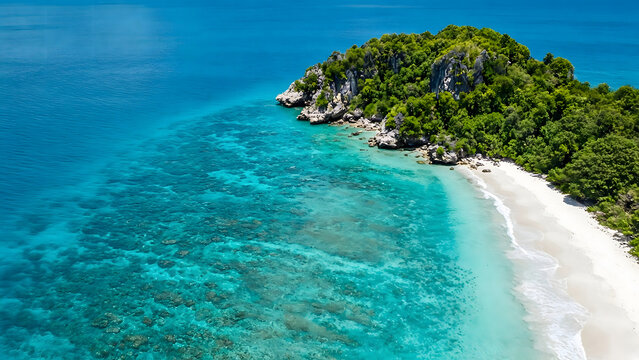 Aerial view of tropical island with turquoise sea and white sand beach