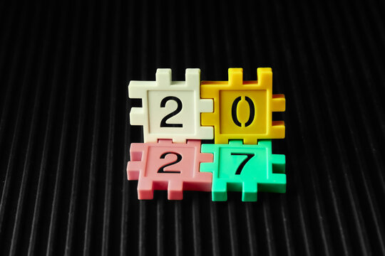 colorful puzzle blocks forming the number 2027