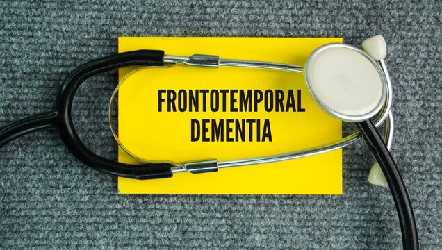 Stethoscope and paper with the word Frontotemporal dementia FTD is a group of progressive brain disorders that damage the frontal and temporal lobes of the brain, which control behavior, personality