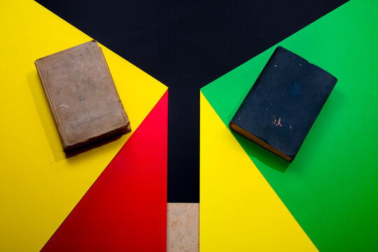Abstract background featuring two vintage books against a colored backdrop