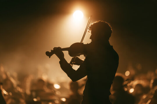 Violinist Performing Under Dramatic Stage Spotlight