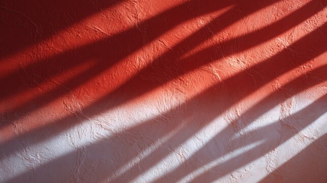 Diagonal shadows of palm leaves projected onto a textured terracotta and white wall in bright natural sunlight.Architecture and interior design blogs, minimalist art and background archives