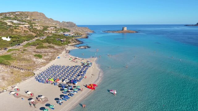 Experience the stunning beauty of La Pelosa Beach in Sardinia, Italy, showcasing crystal-clear waters and soft sands. Perfect for a relaxing holiday or invigorating travel adventure.