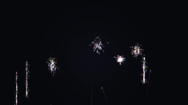 Spectacular vibrant colorful fireworks display exploding in the night sky for grand celebration events such as New Year and Independence Day parties.